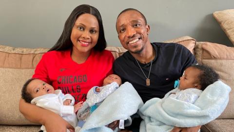 Mum Osaretin and Dad Israel and their triplets