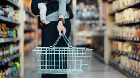 Woman with baby in supermarket