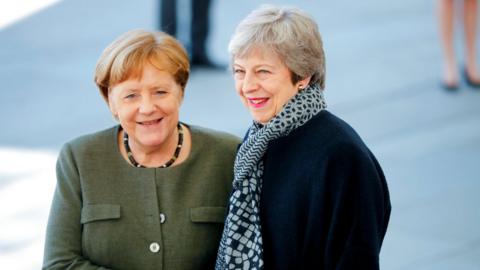 German Chancellor Angela Merkel greets Theresa May in Berlin