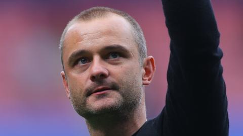 Wigan Athletic boss Shaun Maloney celebrating their League One football win at Bolton Wanderers