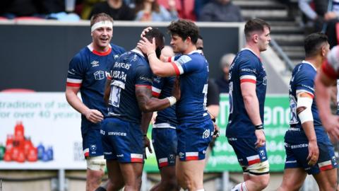 Bristol Bears players celebrate a try against Gloucester