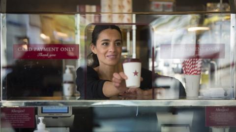 Pret barista serving coffee