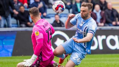 Stoke keeper Jack Bonham defies Matt Godden in last season's 4-0 win at Coventry