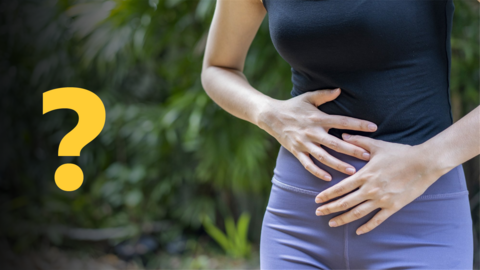 A woman holding her stomach