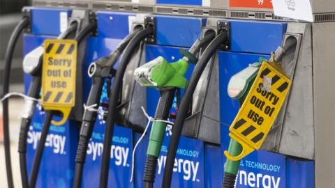 Pumps with out of use signs at an Esso petrol station