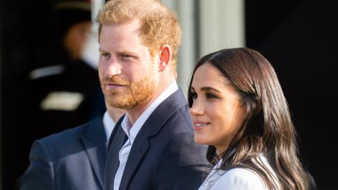 Prince Harry, Duke of Sussex (C) and his wife, Meghan, Duchess of Sussex (R) arrive on the Yellow Carpet before the start of the Invictus Games in The Hague