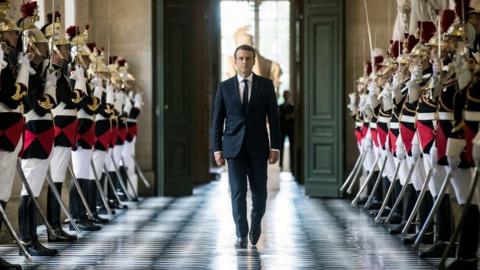 French President Emmanuel Macron walks through the Galerie des Bustes (Busts Gallery) to access the Versailles Palace - 3 July 2017