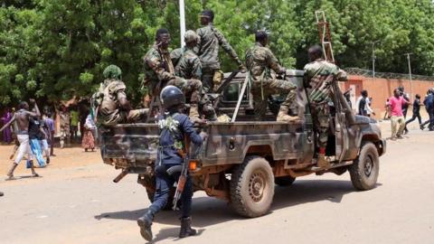 Pro-junta protesters gather outside the French Embassy in Niamey