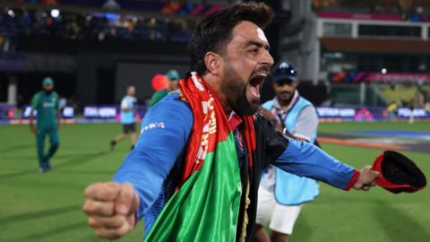 Afghanistan's Rashid Khan roars in celebration after beating Pakistan