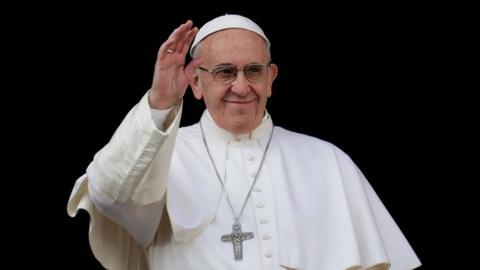 Pope Francis waves to faithful before giving his Christmas Day blessing
