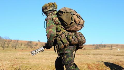 Welsh Guards platoon live firing training at Sennybridge Training Area, Wales, United Kingdom. - stock photo