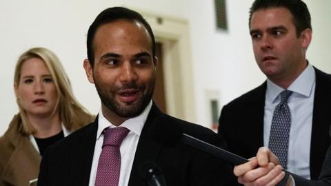 Former Trump campaign adviser George Papadopoulos (C)