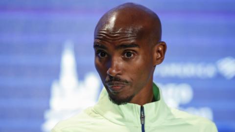 Four-time Olympic champion Mo Farah speaks at a news conference