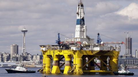 In this May 14, 2015, file photo, the oil drilling rig Polar Pioneer is towed toward a dock in Elliott Bay in Seattle.