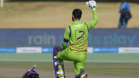 A South Africa cricketer takes a knee