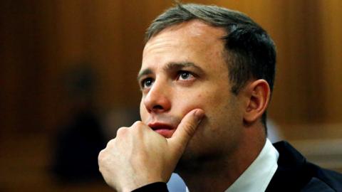 : Olympic and Paralympic track star Oscar Pistorius looks on ahead of his manslaughter sentencing hearing for the 2013 killing of his girlfriend Reeva Steenkamp