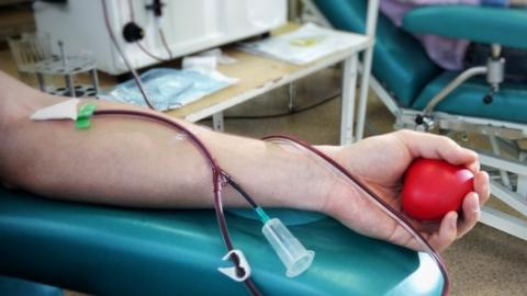 A person gives blood