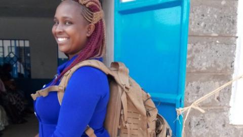 Midwife Margaret Wairimu Maina carries a technology-packed backpack