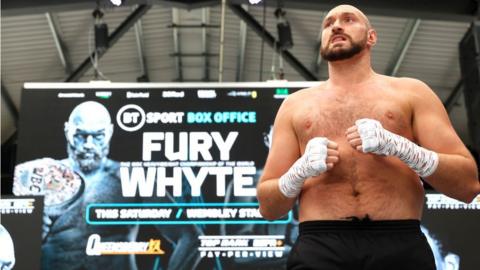 Tyson Fury looks on at a workout