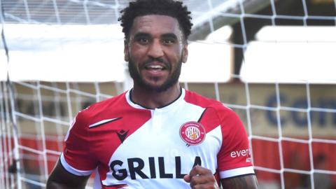 Jamie Reid celebrates scoring for Stevenage