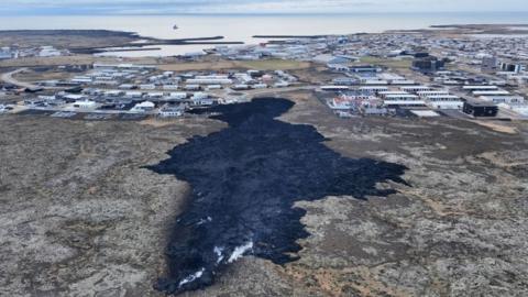 An aerial view taken on January 15, 2024 shows a lava stream near Grindavik