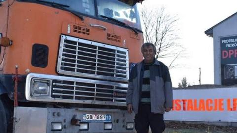 Fardin Kazemi in front of his broken-down American International 9670 lorry