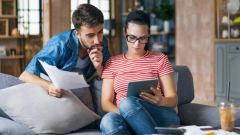 Young couple looking at tablet