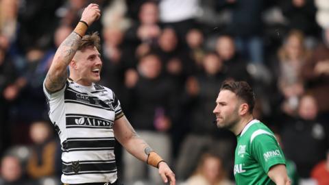 Hull FC's Liam Sutcliffe celebrates one of his tries against Huddersfield