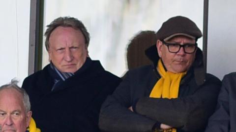 Michael Westcott (right) sits next to experienced former Torquay United manager Neil Warnock at a game at Plainmoor