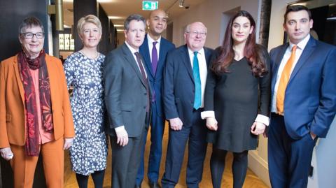 Seven Labour MPs who resigned stand together after their presser