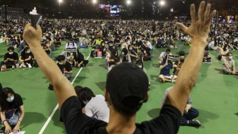 People take part in a vigil to remember the victims of the 1989 Tiananmen Square Massacre in Hong Kong, on 4 June, 2020