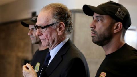 Brazilian Olympic Committee (COB) President Carlos Arthur Nuzman leaves the Federal Police headquarters heading to jail, in Rio de Janeiro, Brazil, October 5, 2017