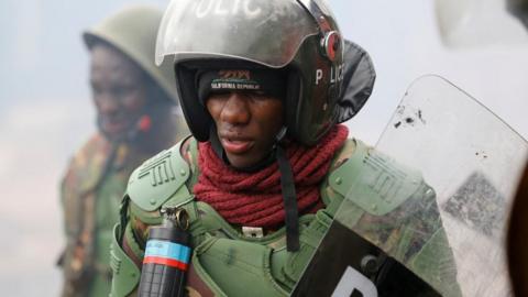 Riot police officers react, as supporters of Kenya's opposition leader Raila Odinga of the Azimio La Umoja (Declaration of Unity) One Kenya Alliance participate in an anti-government protest against the imposition of tax hikes by the government in Nairobi, Kenya July 19, 2023