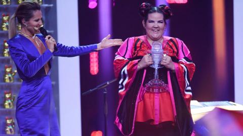 Israel's singer Netta Barzilai aka Netta celebrates with the trophy