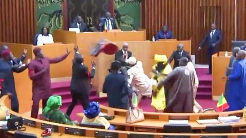 A chair is thrown as MPs brawl in Senegal's parliament