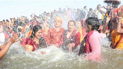 Women take a dip at the Kumbh Mela