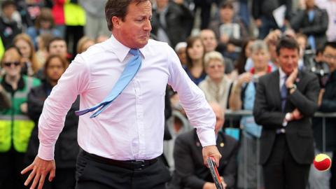 David Cameron playing tennis