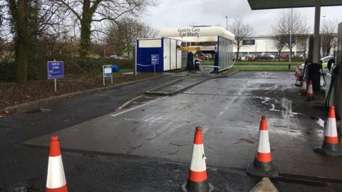 The car wash cordoned off with police tape in Newport