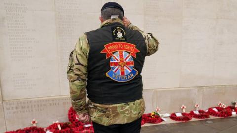 Motorcyclist at memorial wall