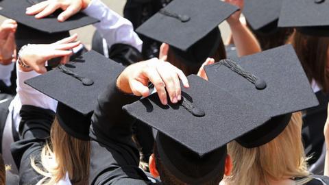 Graduates in cap and gown