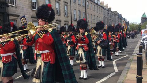 servicemen and women march through central Edinburgh for the annual Armed Forces Day