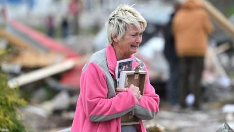 Woman reacts to destroyed school in Sullivan, Indiana