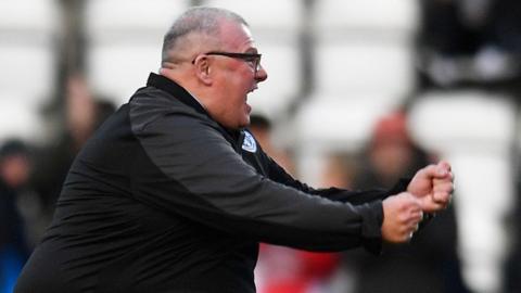 Steve Evans celebrates a Stevenage goal against Derby County