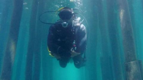 A man diving in Lake Ohrid, Macedonia