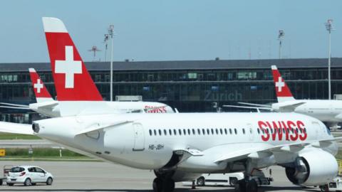 Passenger planes of Swiss airlines stand on the tarmac at Zurich Airport on June 14, 2021 in Zurich