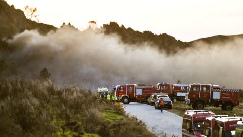 Emergency workers at the site of a fireworks factory, in Avoes, Lamego, Portugal on 4 April