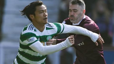 Celtic's Reo Hatate and Hearts' Michael Smith