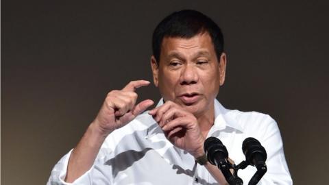 Philippines" President Rodrigo Duterte delivers a speech at the Philippines Economic Forum in Tokyo on October 26, 2016.