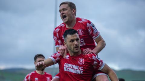 Aaron Williams celebrates scoring for Newtown with Nick Rushton