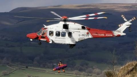 Coastguard rescue helicopter airlifts paraglider to hospital